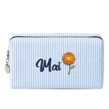 Candy Stripe Pouch xanh dương sáng thêu tên Mai + hoa vạn thọ tháng 10 (ảnh minh hoạ) - Dear eM